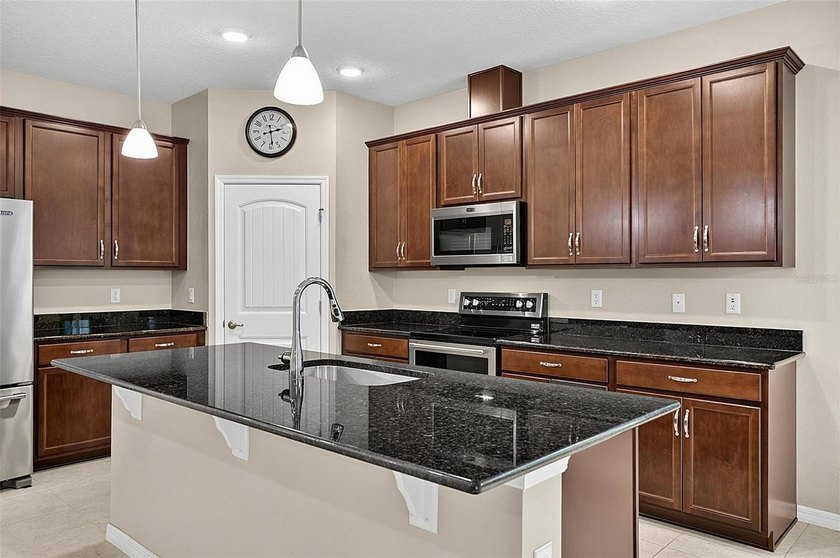 Better than new! Open concept 4 bedroom 3 bath 3 car garage home - photo 28