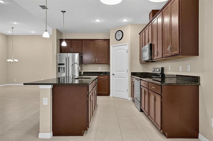Better than new! Open concept 4 bedroom 3 bath 3 car garage home - photo 33