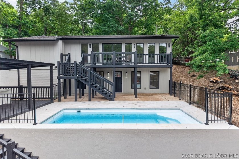LAKE LIVING AT ITS FINEST! Spectacularly remodeled waterfront - photo 4