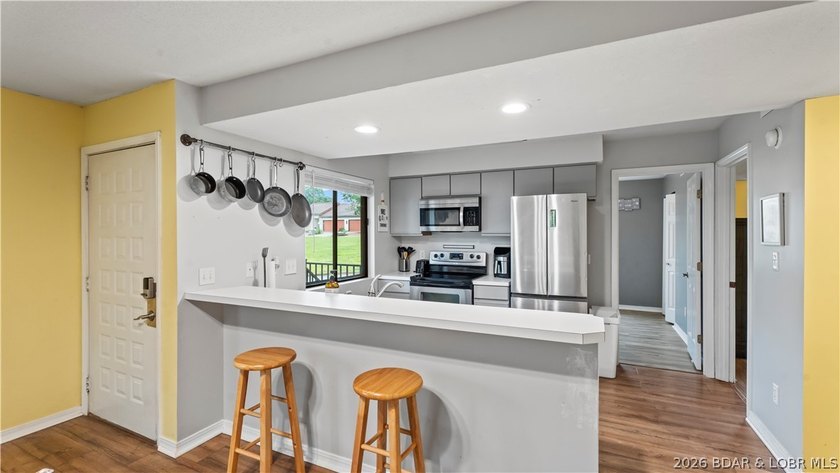 Welcome home to the Osage Vista's community. This top floor unit - photo 5