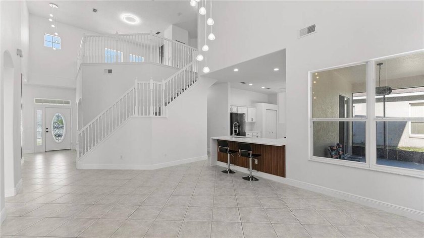 A beautiful, fully remodeled home featuring a new roof and new - photo 12