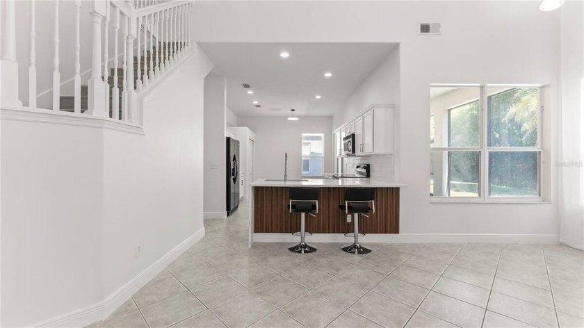 A beautiful, fully remodeled home featuring a new roof and new - photo 13