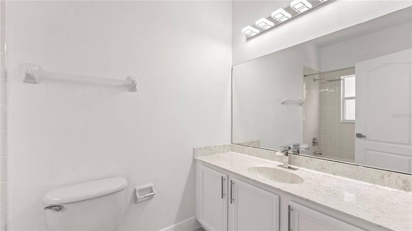 A beautiful, fully remodeled home featuring a new roof and new - photo 22