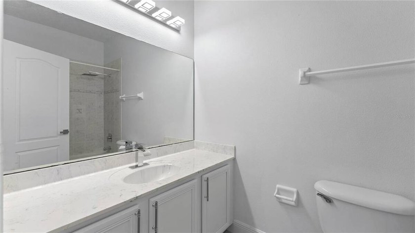 A beautiful, fully remodeled home featuring a new roof and new - photo 25