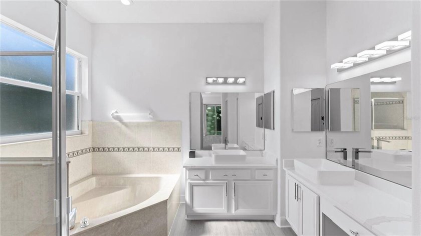 A beautiful, fully remodeled home featuring a new roof and new - photo 39