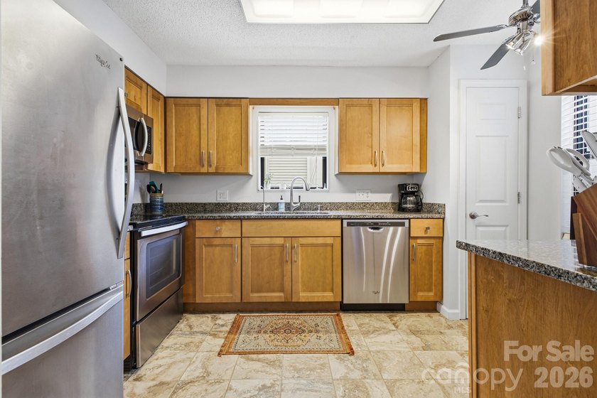 This highly coveted lower-level end unit in the Cloisters - photo 6