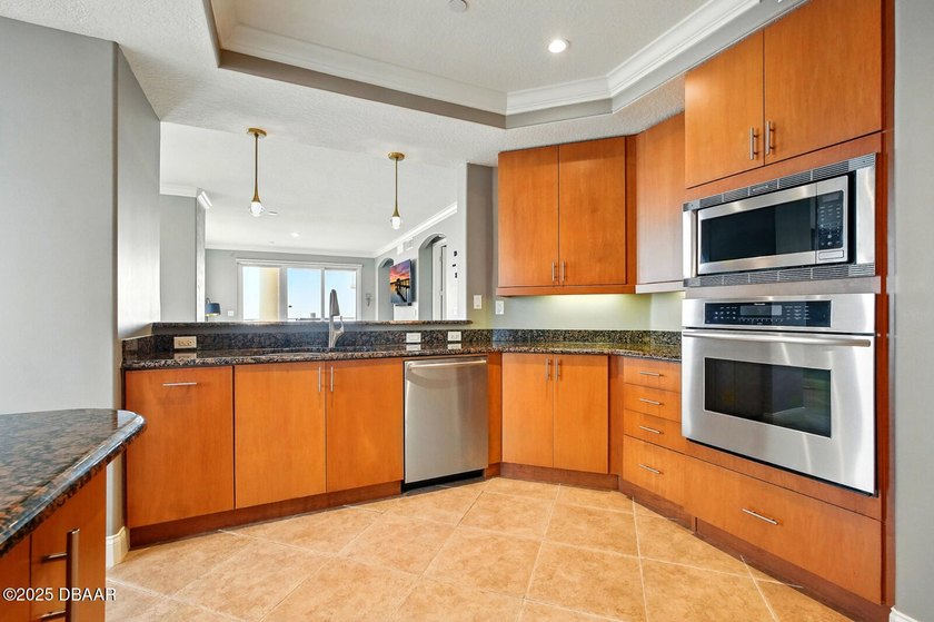 MOTORIZED HURRICANE SHUTTERS! Beautiful end unit condo with - photo 12