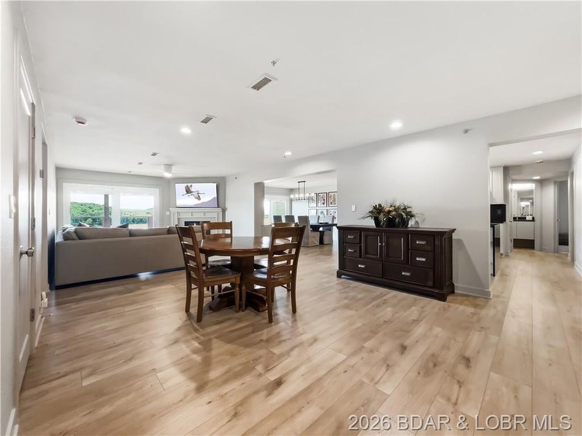 Turnkey luxury and breathtaking lakefront views await in this - photo 9