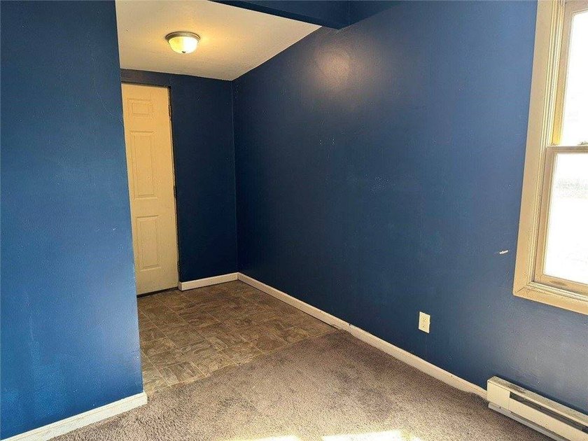 Welcome to this charming ranch-style home in Oswego, NY, ideally - photo 4