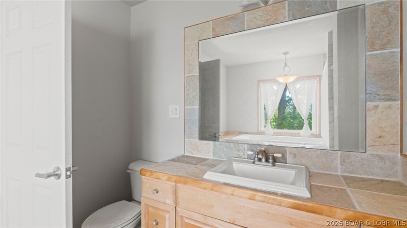 Fix-and-Flip Opportunity with Incredible Lakefront Views This - photo 4