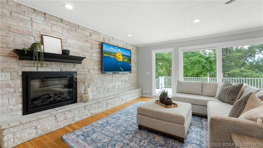 Lakefront living at its finest! This updated 4-bedroom, 3-bath - photo 7