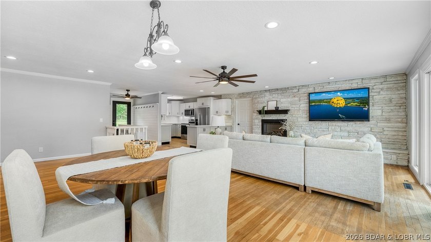 Lakefront living at its finest! This updated 4-bedroom, 3-bath - photo 8