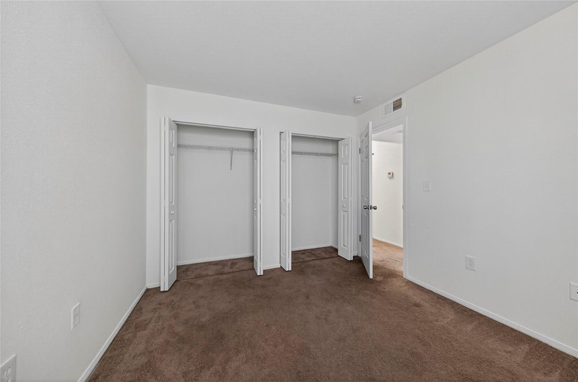 First-floor lakefront unit with screened patio in a gated - photo 19