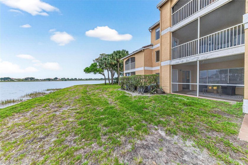 First-floor lakefront unit with screened patio in a gated - photo 25