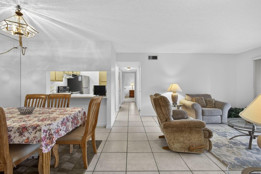 Enjoy peaceful lake views from this condo w/ living/dining room - photo 12
