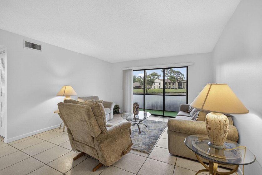 Enjoy peaceful lake views from this condo w/ living/dining room - photo 17