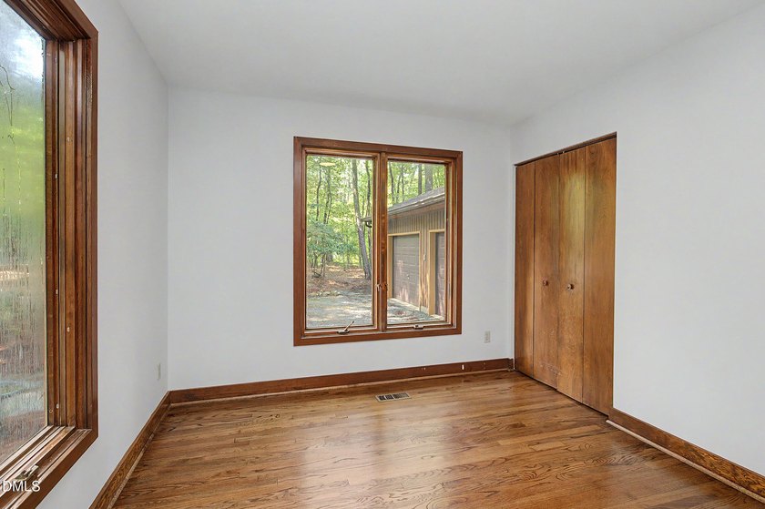 Tucked away on a sprawling corner lot of over 1/2 an acre in the - photo 12