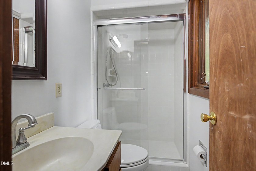 Tucked away on a sprawling corner lot of over 1/2 an acre in the - photo 14