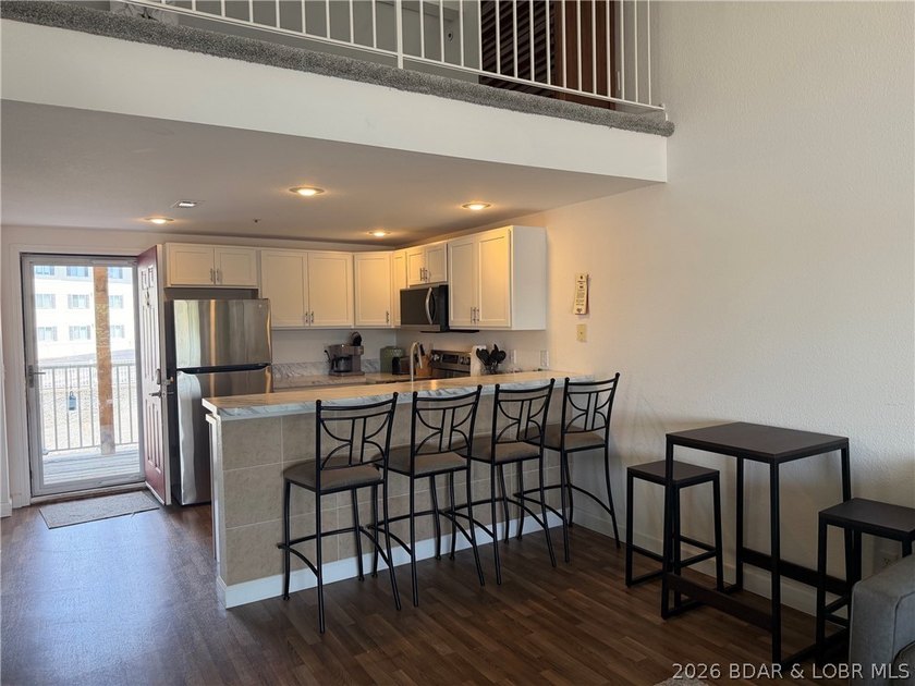 Indulge in stunning lake views from this remarkable 3-bedroom - photo 5