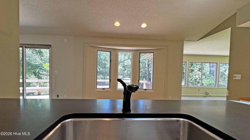 Enjoy peaceful waterfront living in this full-brick, 3-bedroom - photo 11