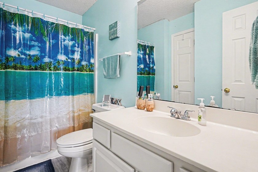 This 3-bedroom, 2-bathroom condo features a bright living room - photo 13