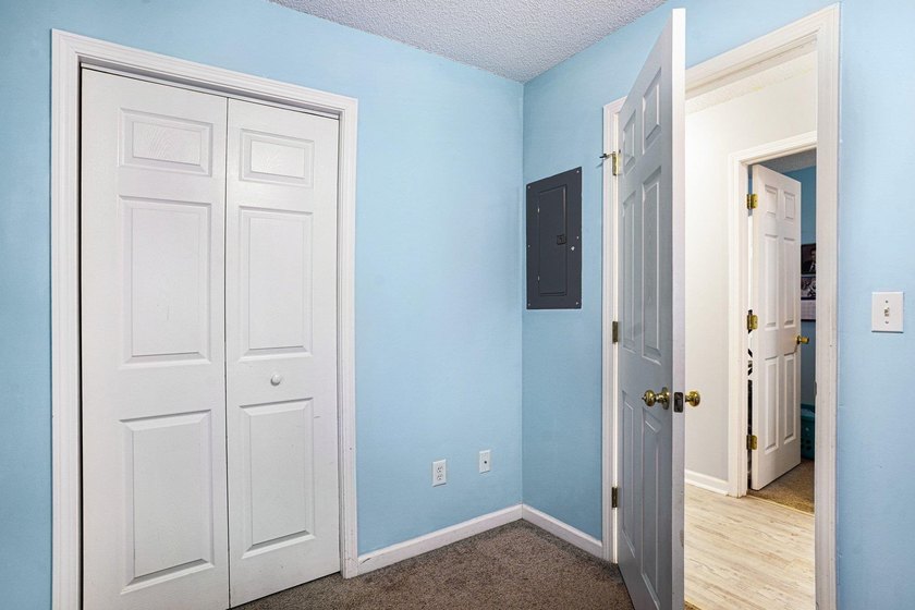 This 3-bedroom, 2-bathroom condo features a bright living room - photo 17