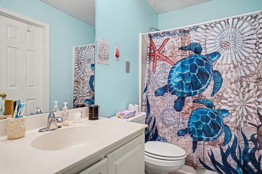 This 3-bedroom, 2-bathroom condo features a bright living room - photo 18
