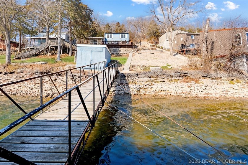 Tucked along the shoreline in year-round deep water, this - photo 4