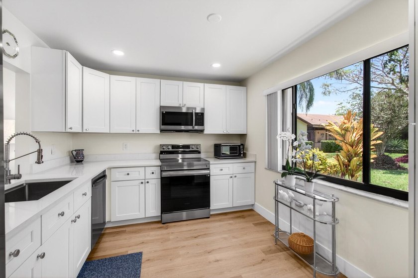 Experience modern luxury in this impeccably renovated corner - photo 16