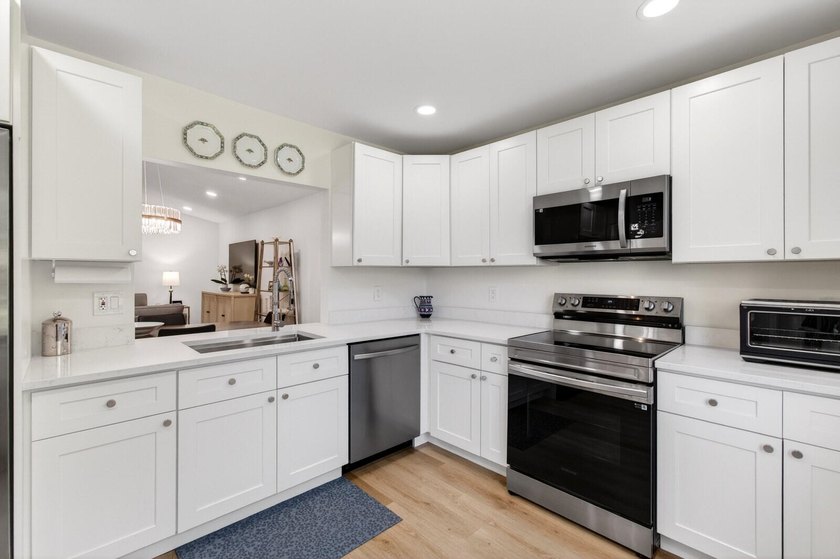 Experience modern luxury in this impeccably renovated corner - photo 17