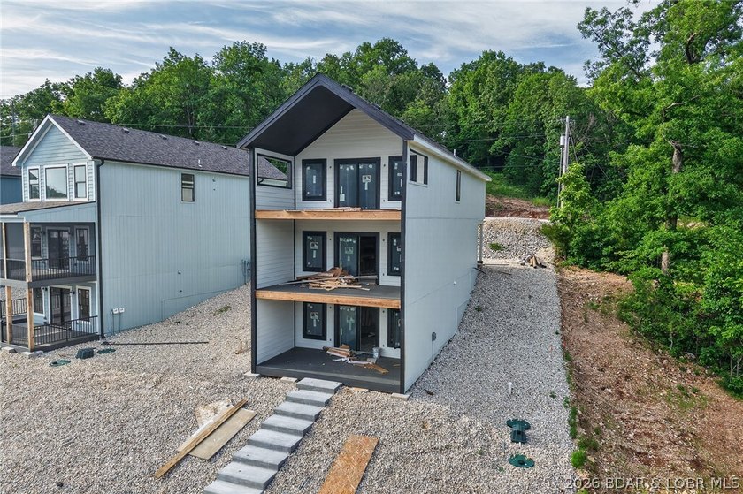 BRAND NEW LAKE HOME AND DOCK!!! The perfect blend of modern - photo 2