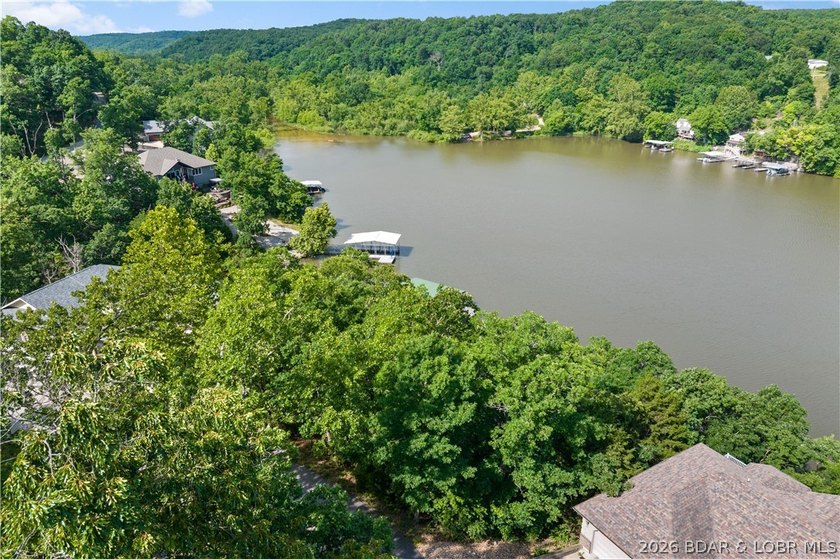 Discover this premier lakefront lot in the highly sought-after - photo 3