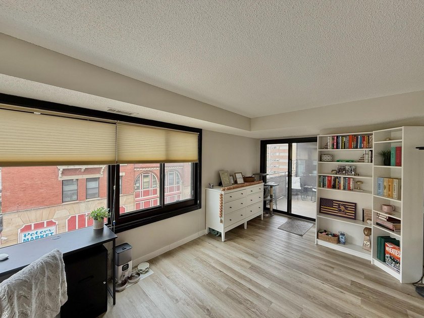 This bright and generously sized corner unit offers an open - photo 5