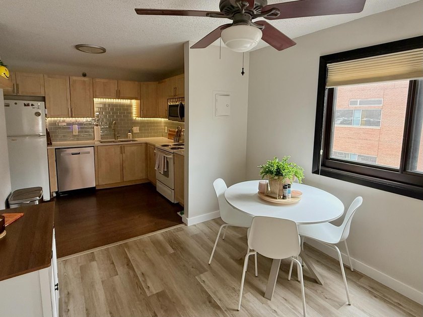 This bright and generously sized corner unit offers an open - photo 9