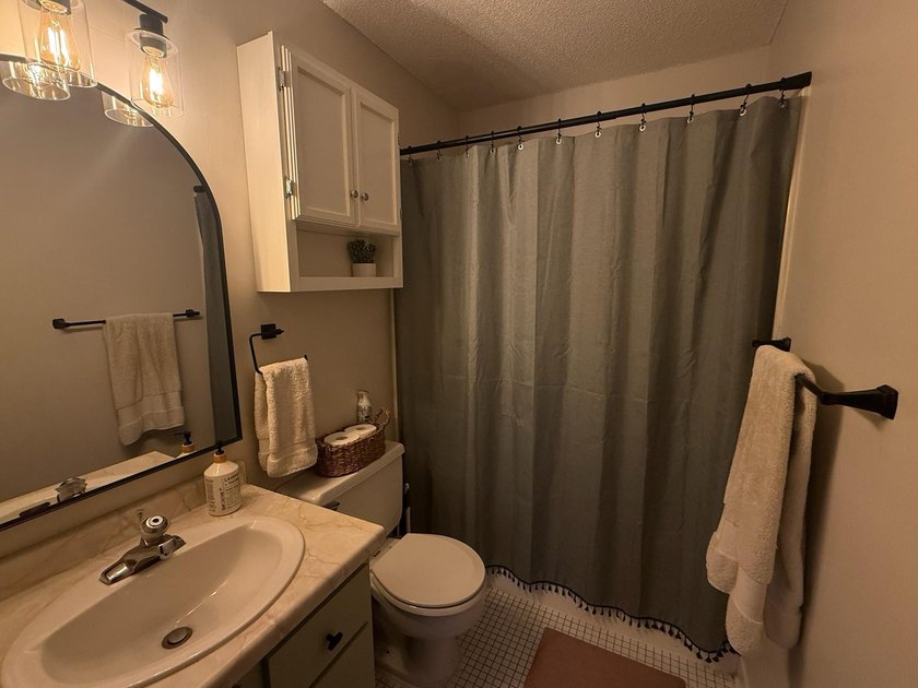 This bright and generously sized corner unit offers an open - photo 10