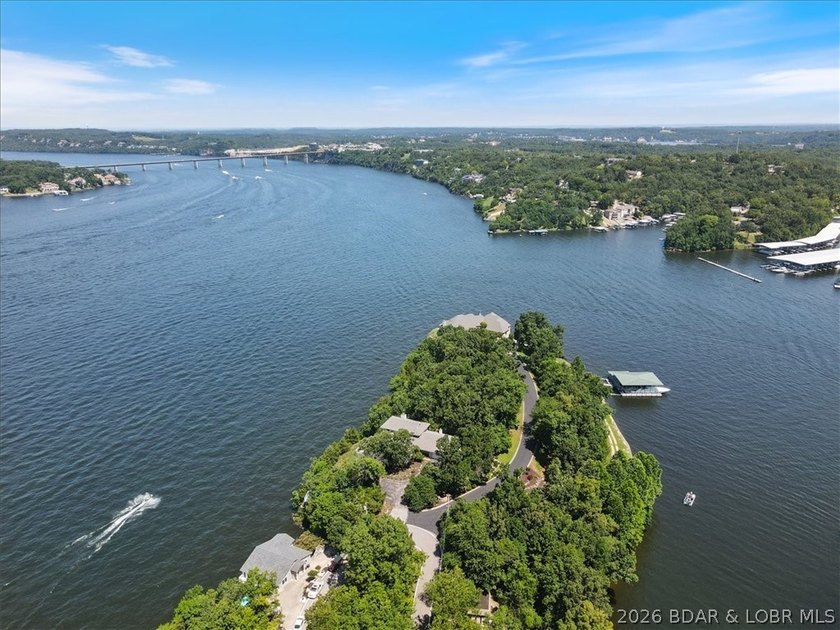 Perched above the shimmering waters of the Lake of the Ozarks - photo 8
