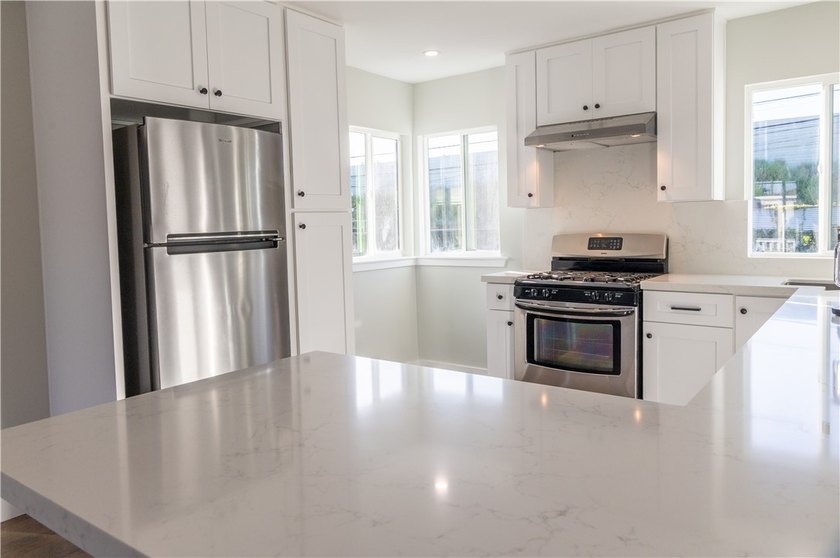 Welcome to this beautifully refreshed home located in the - photo 3