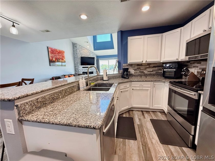 Lake life just got a serious glow-up! This beautifully remodeled - photo 6