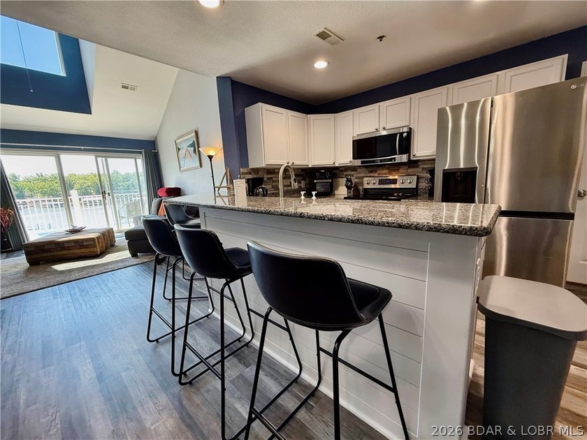 Lake life just got a serious glow-up! This beautifully remodeled - photo 10