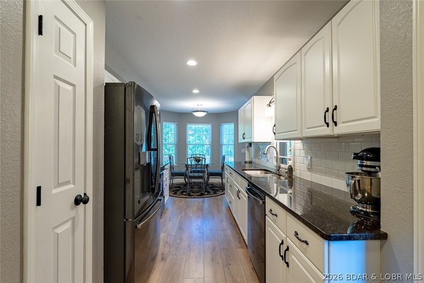 Located on a quiet cul-de-sac w/seasonal lake view in the highly - photo 10
