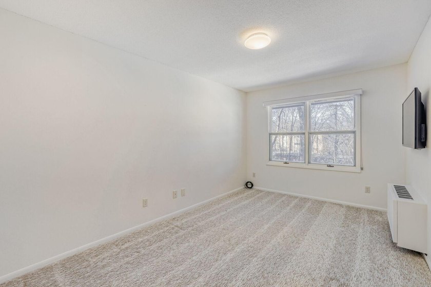 Move right into this top-floor, one-level home offering - photo 9
