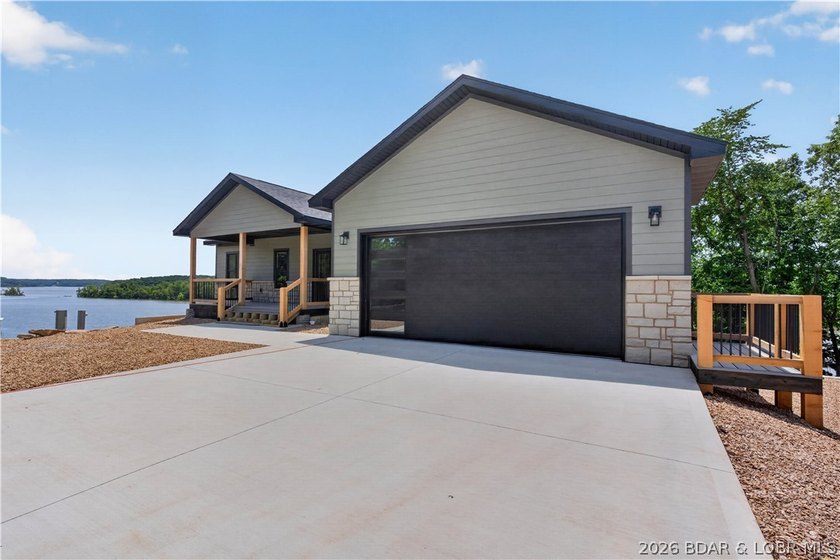 Stunning new-construction waterfront home at the Lake of the - photo 2