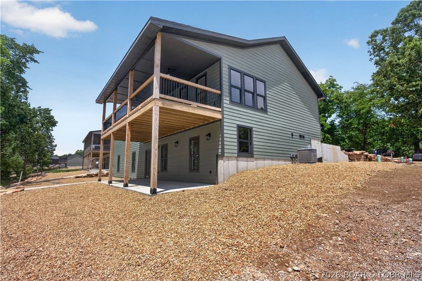 Stunning new-construction waterfront home at the Lake of the - photo 8