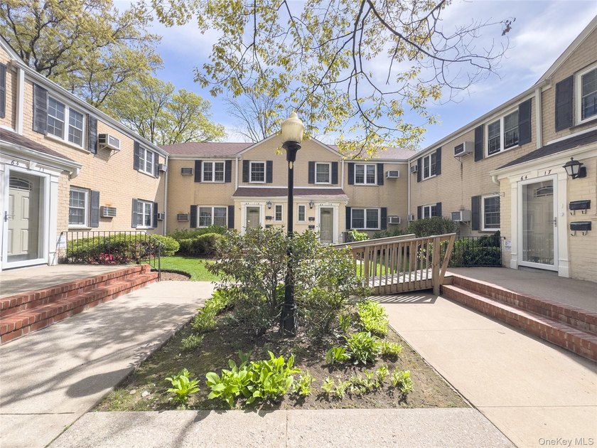 Tucked within the quiet, tree-lined Estates at Bayside, this - photo 2