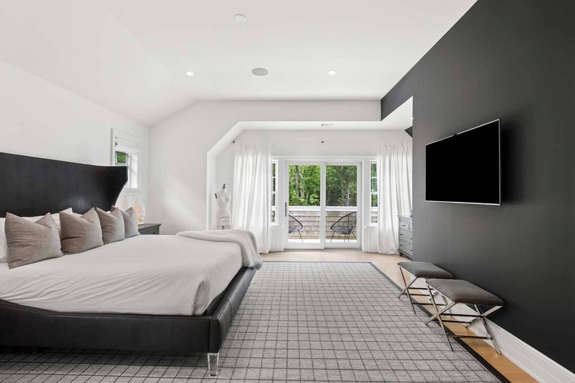 Enter through a dramatic double-height foyer into the refined - photo 22