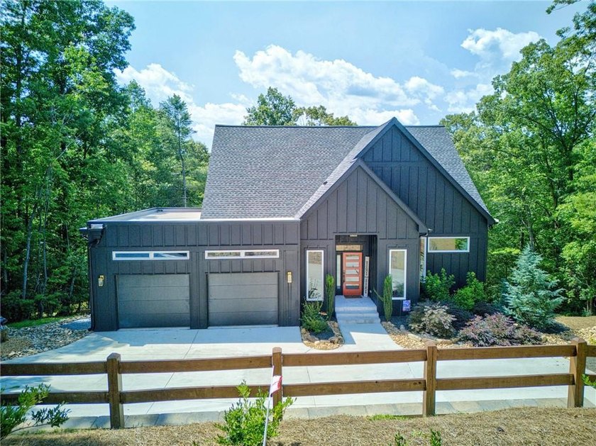 100+ FEET OF CHATTAHOOCHEE RIVER FRONTAGE AND A MODERN HOME TO - photo 2