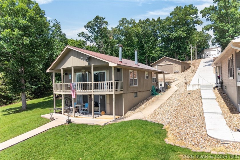 Lakefront living on the desirable 53 Mile Marker! Nestled in the - photo 4