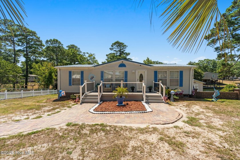 Enjoy coastal living just minutes from the sandy shores of - photo 5