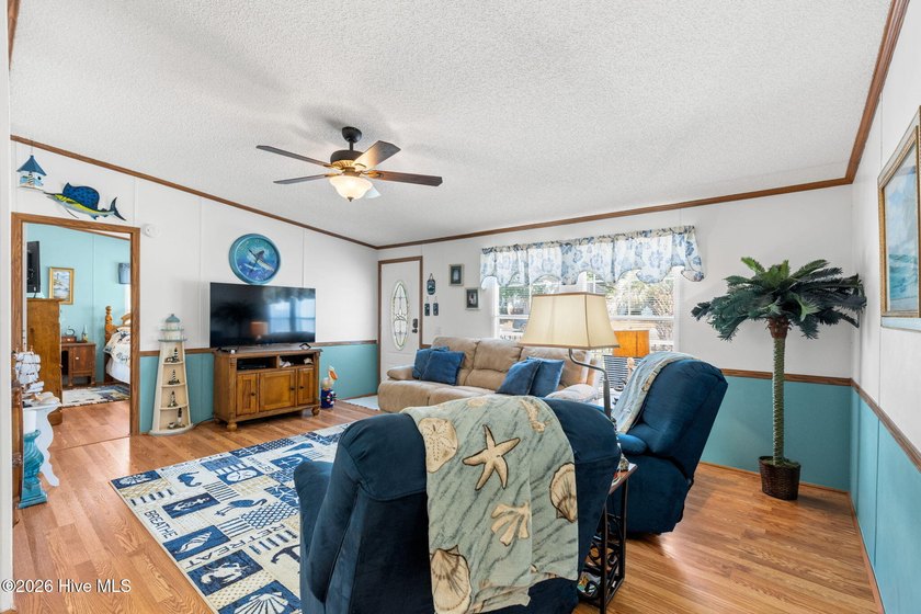 Enjoy coastal living just minutes from the sandy shores of - photo 6