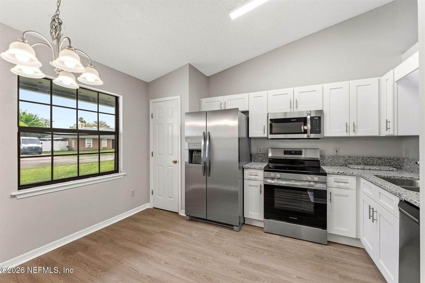 Welcome Home to Cinnamon Lakes! This 3 bedroom, 2 bath gem is - photo 6